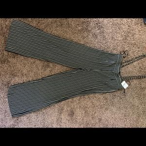 Black and white striped overall pants.